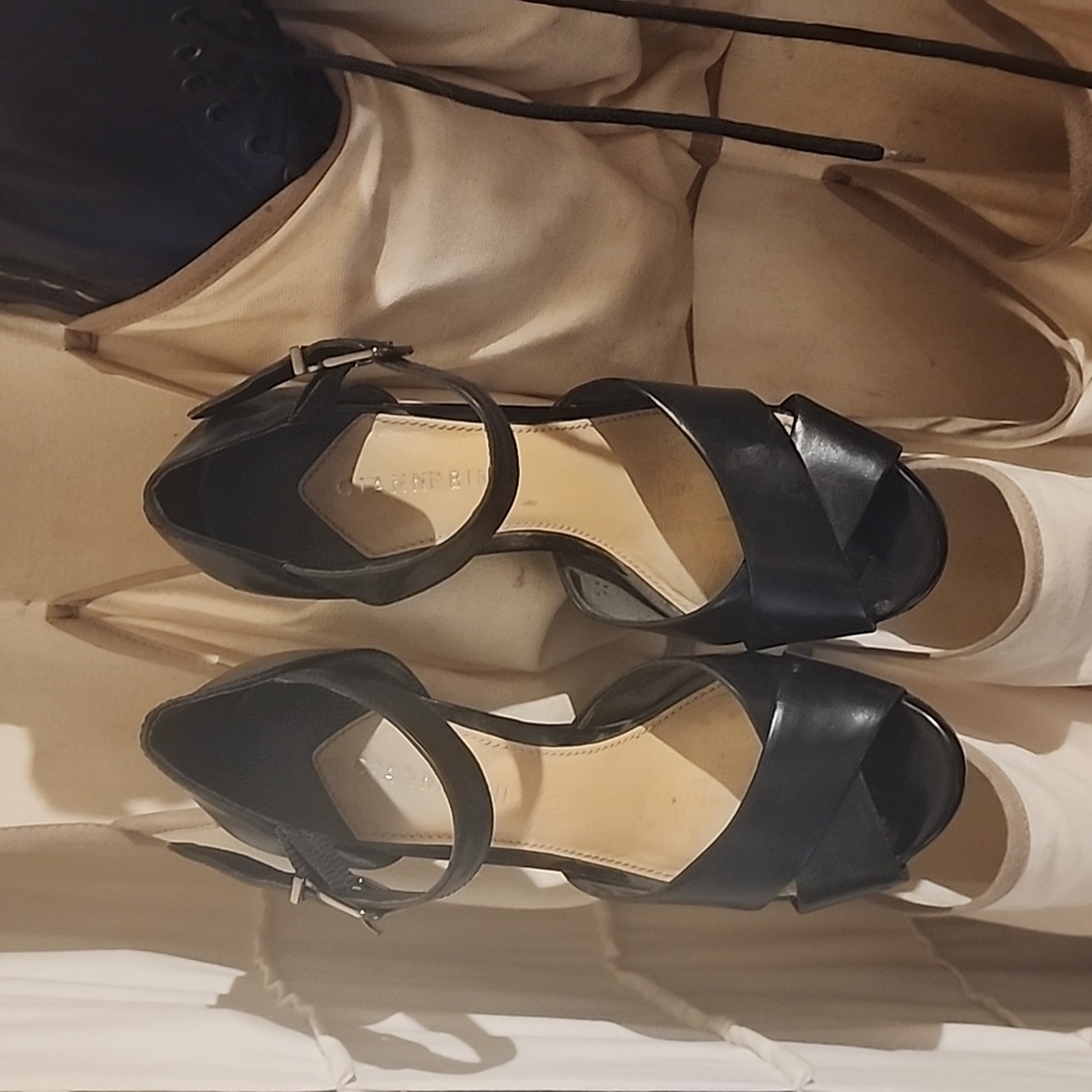 Size 7.5  6 inch platform sandles in fantastic condition .